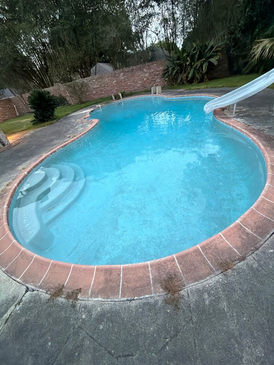 Kidney pool with slide after cleaning, clear water