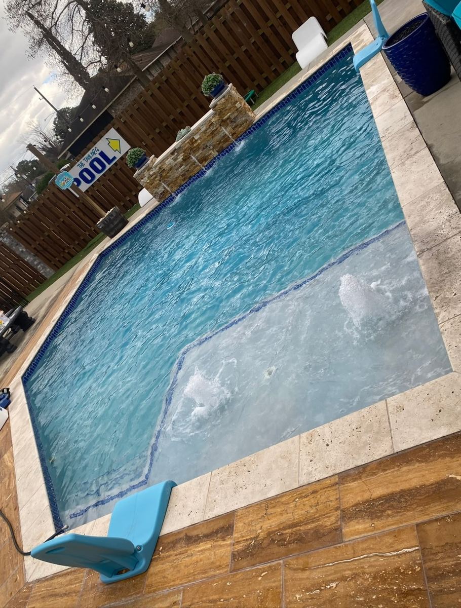 Clean, clear pool maintained by Integrity Touch
