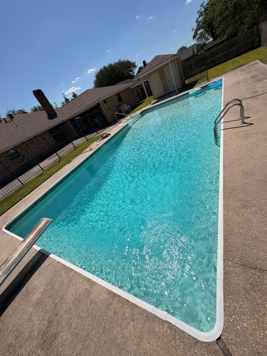 Backyard pool after cleaning, clear water